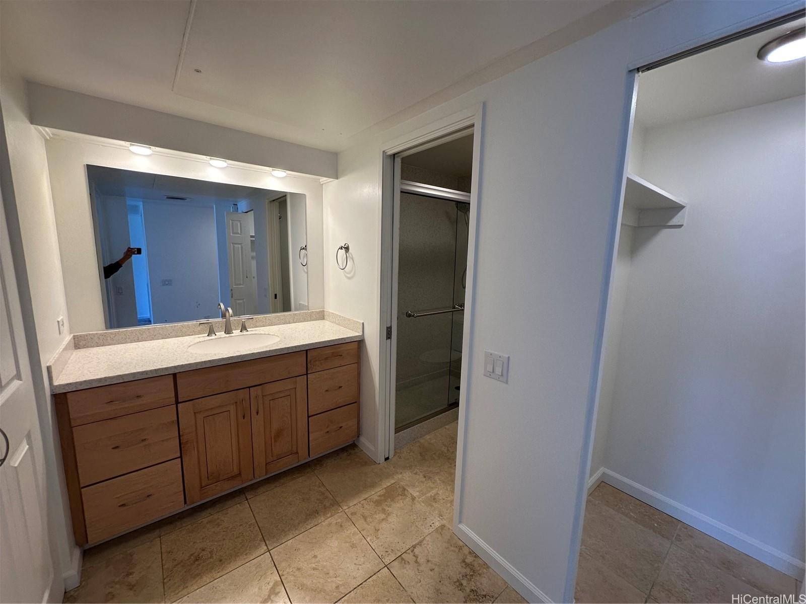 700 Richards Street, Unit 1708 Honolulu, HI 96813 - Photo 6 of 18 a bathroom with a double vanity sink and mirror