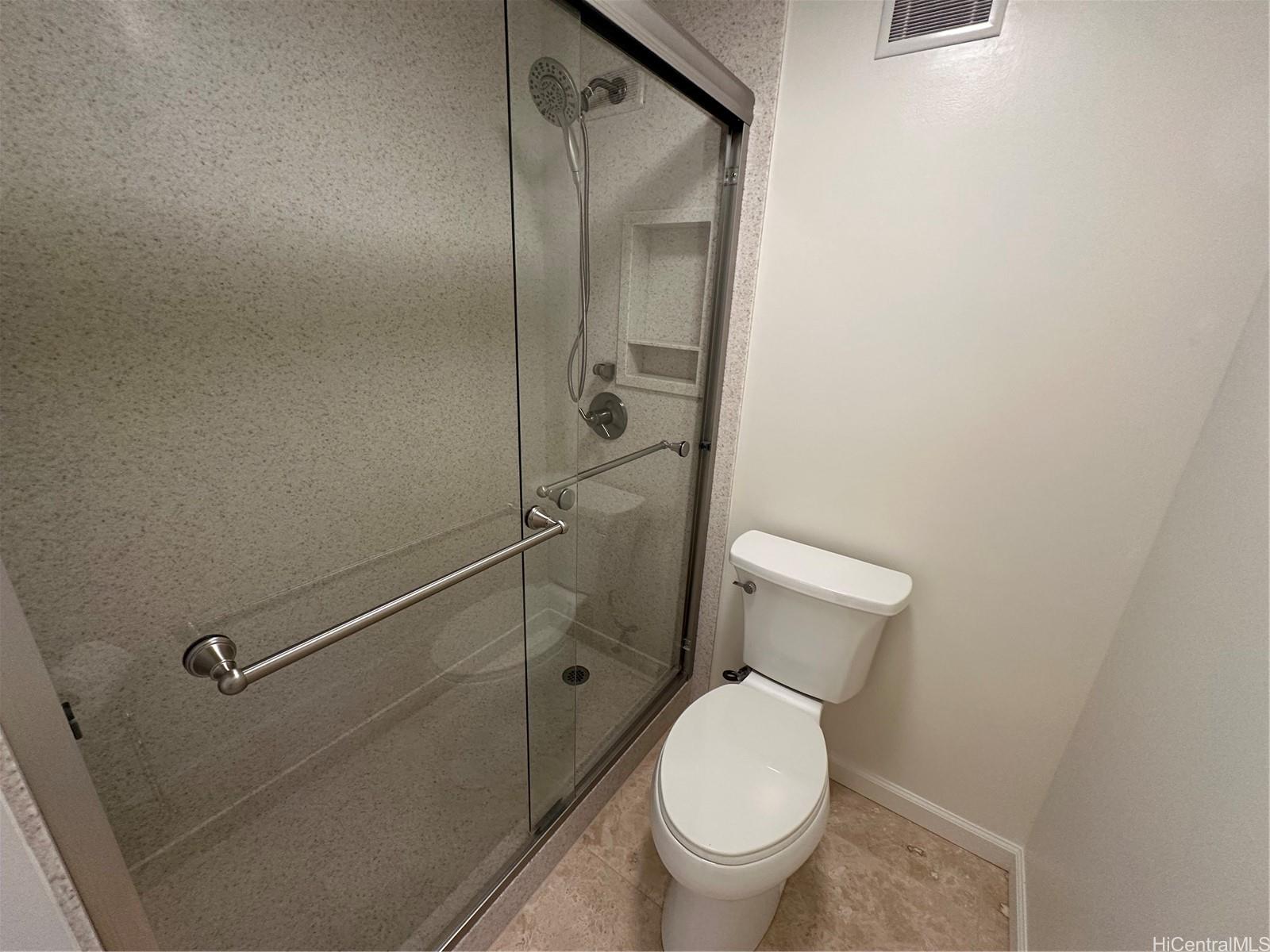 700 Richards Street, Unit 1708 Honolulu, HI 96813 - Photo 7 of 18 a bathroom with a granite countertop toilet and a shower