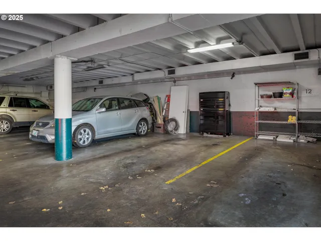 a view of parking garage with cars