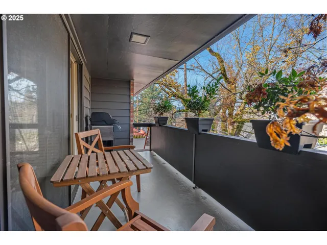 a view of a chairs and table in patio