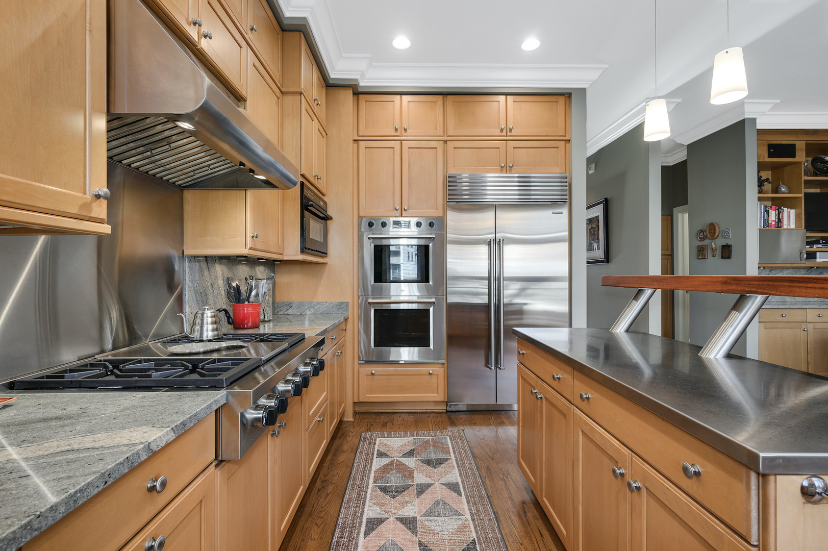 481 North Canal Street Chicago, IL 60654 - Photo 11 of 50 a kitchen with stainless steel appliances granite countertop a refrigerator and a stove