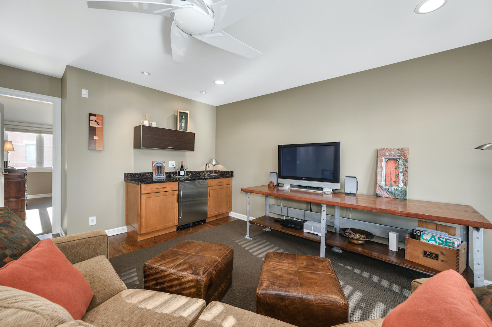 481 North Canal Street Chicago, IL 60654 - Photo 22 of 50 a living room with furniture and a flat screen tv