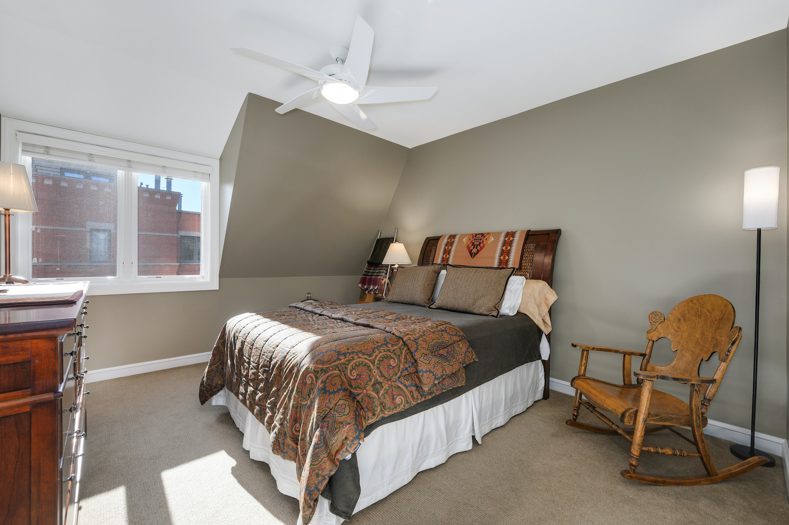 481 North Canal Street Chicago, IL 60654 - Photo 24 of 50 a bedroom with a bed chair and window