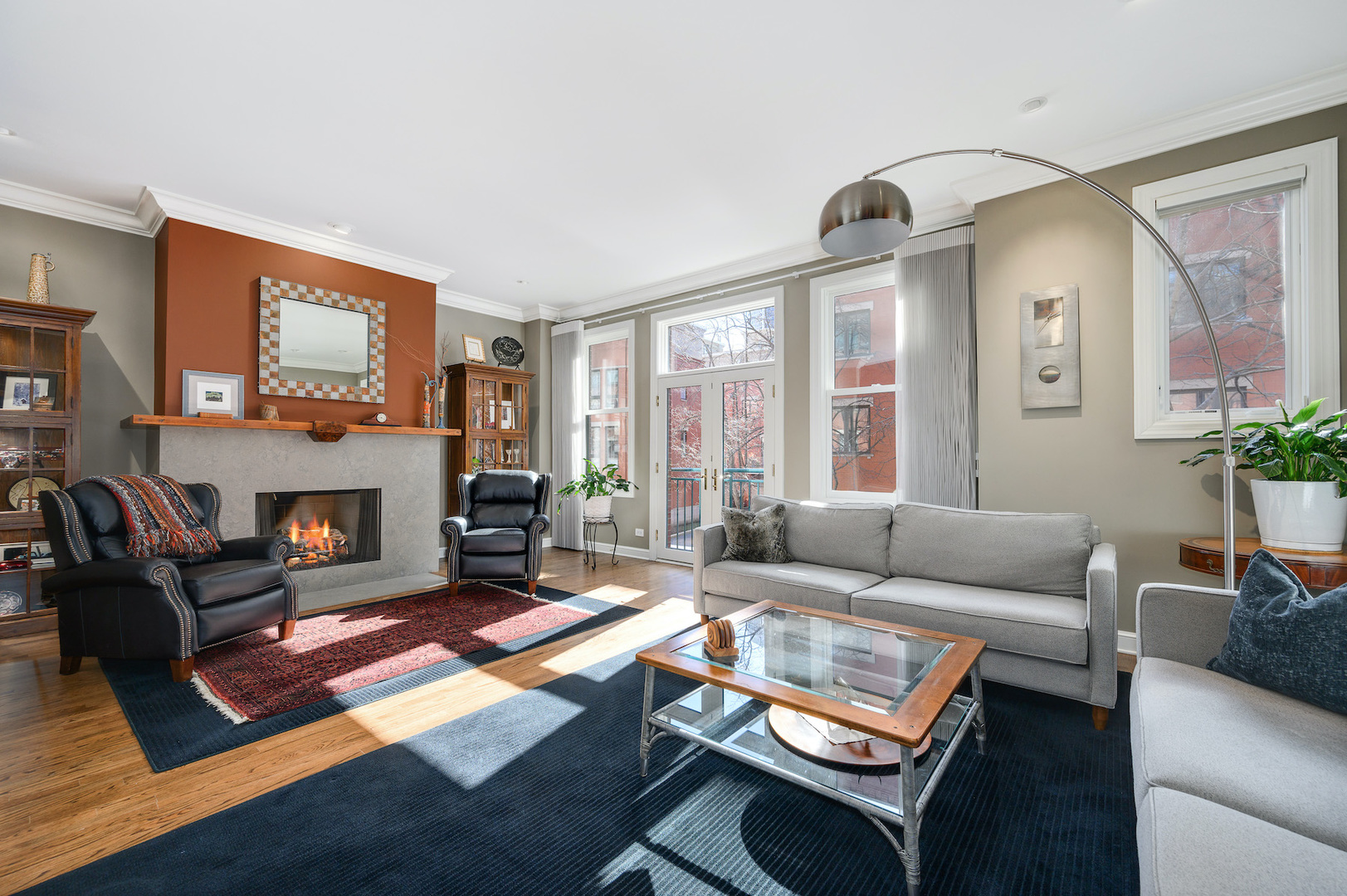 481 North Canal Street Chicago, IL 60654 - Photo 6 of 50 a living room with furniture a flat screen tv and a fireplace