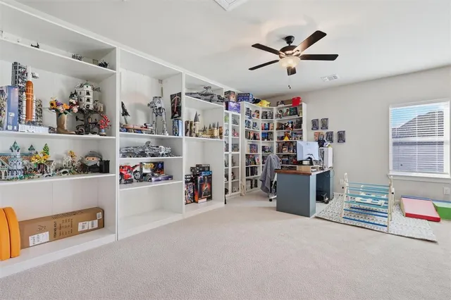 a workspace with furniture and white walls