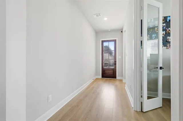 wooden floor in a hall with an entryway