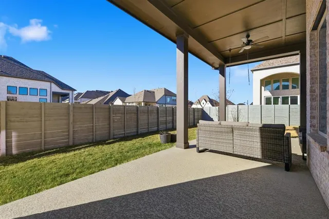 a balcony with furniture and a garden