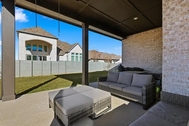 a outdoor space with patio furniture and a fireplace
