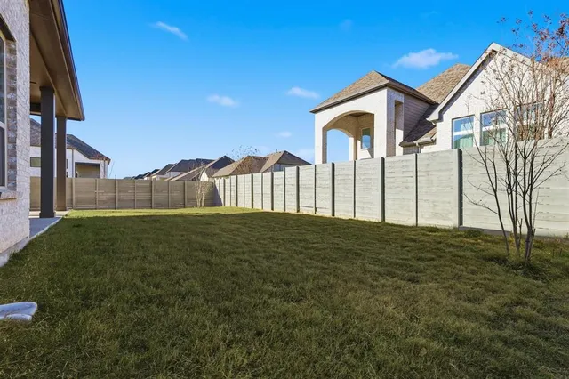 an aerial view of a residential apartment building with a yard