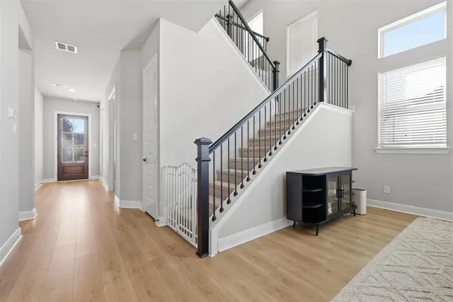 a view of a dining room with furniture and window