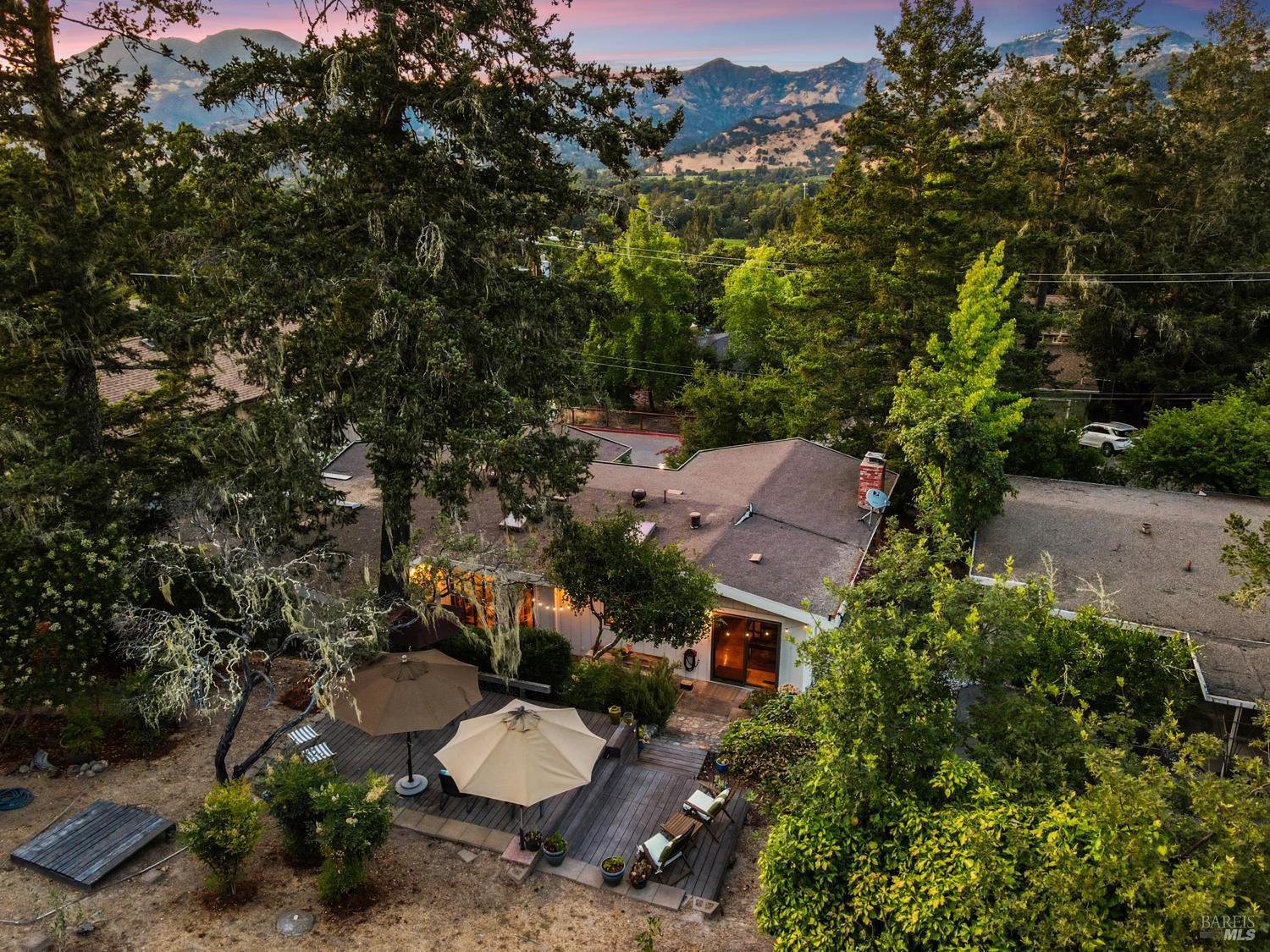 304 High Street Calistoga, CA 94515 - Photo 11 of 53 an aerial view of a house with yard and mountain view in back