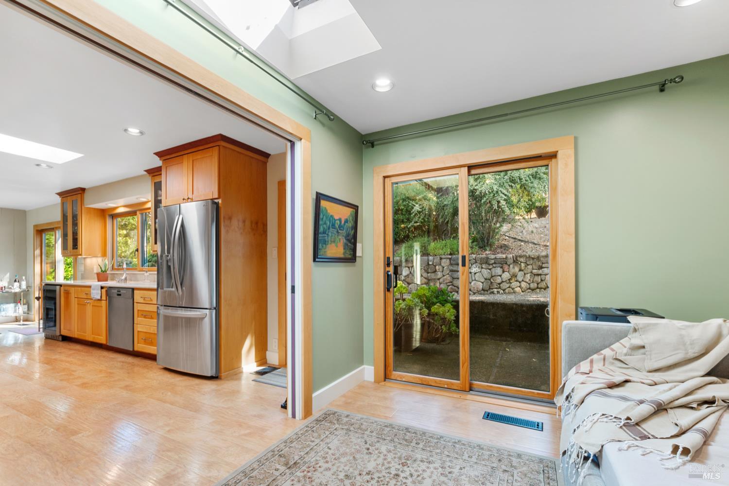 304 High Street Calistoga, CA 94515 - Photo 26 of 53 a living room with stainless steel appliances furniture and a kitchen view
