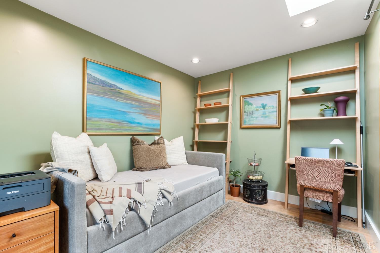304 High Street Calistoga, CA 94515 - Photo 27 of 53 a bed room with a bed and a chair