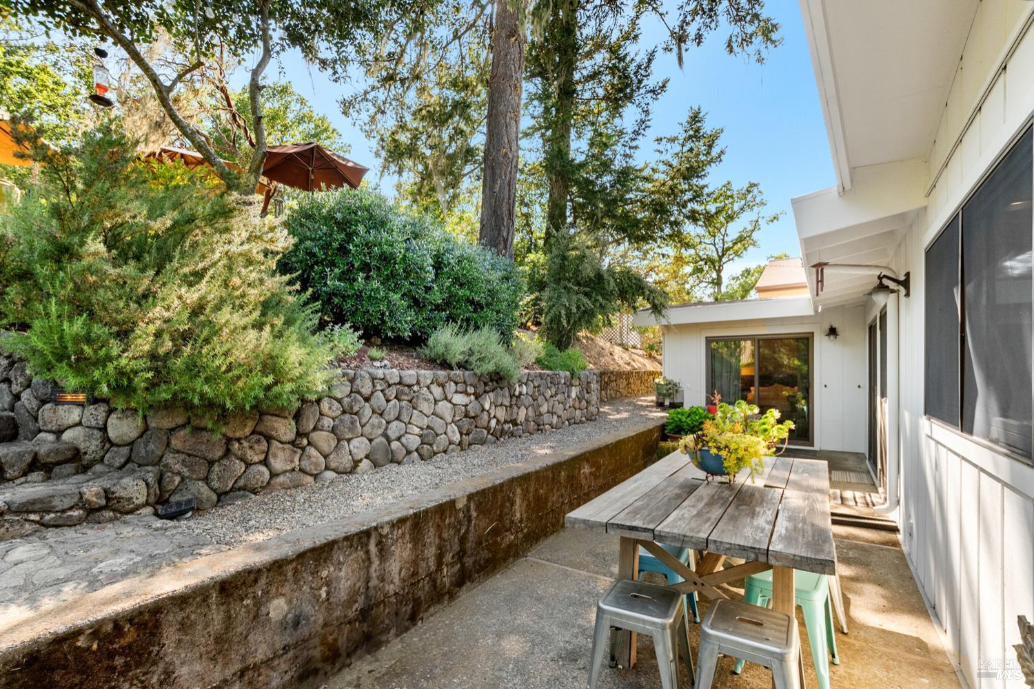 304 High Street Calistoga, CA 94515 - Photo 39 of 53 a view of a chairs and table in a yard