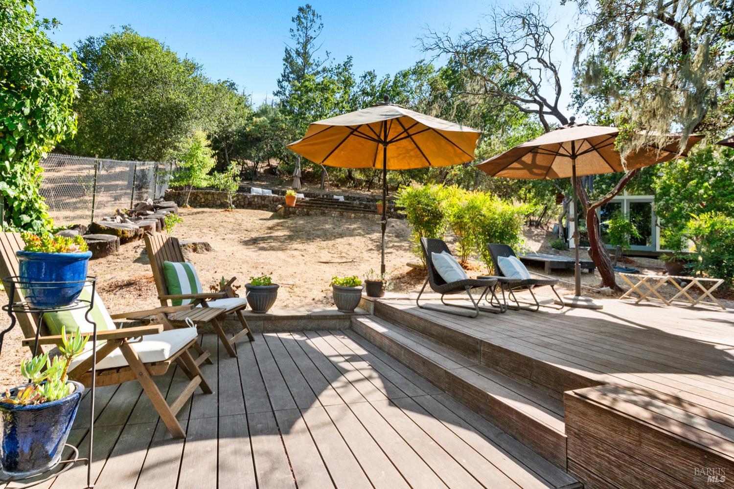 304 High Street Calistoga, CA 94515 - Photo 42 of 53 a view of backyard with outdoor seating and trees