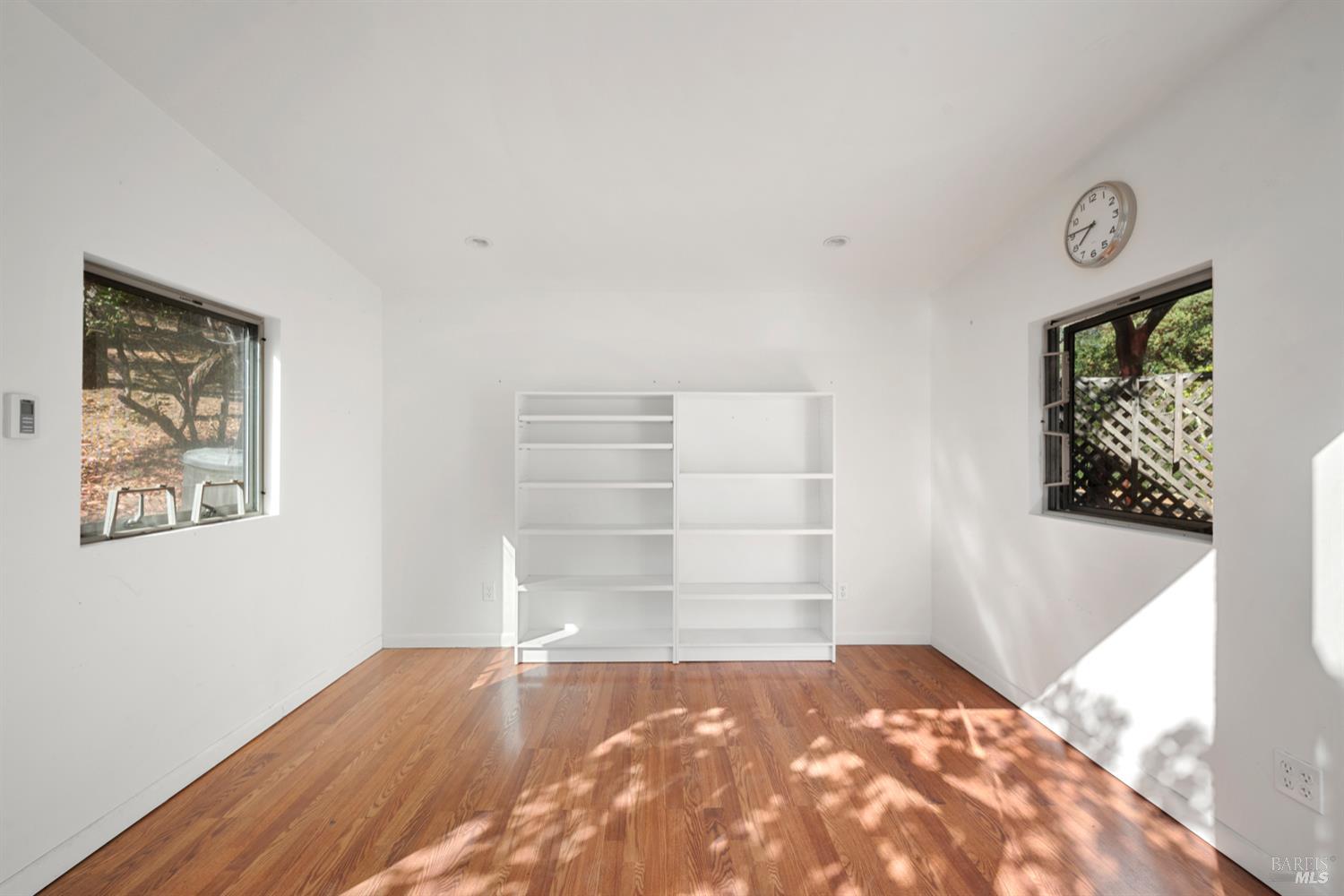 304 High Street Calistoga, CA 94515 - Photo 45 of 53 a view of a bedroom with wooden floor and closet