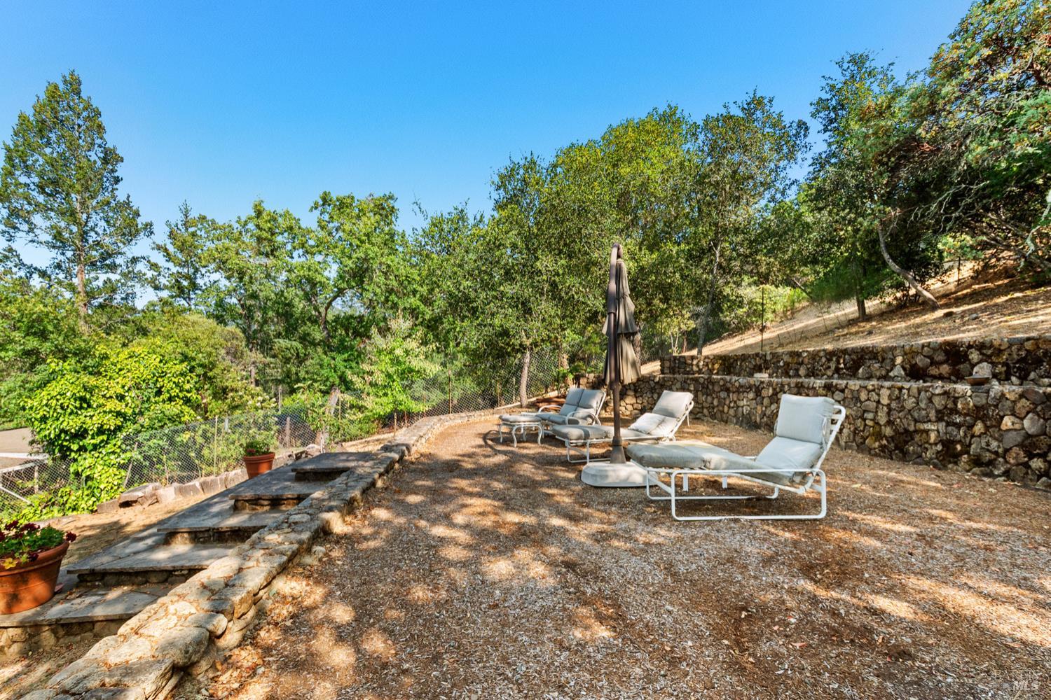 304 High Street Calistoga, CA 94515 - Photo 47 of 53 a view of a bench in a backyard