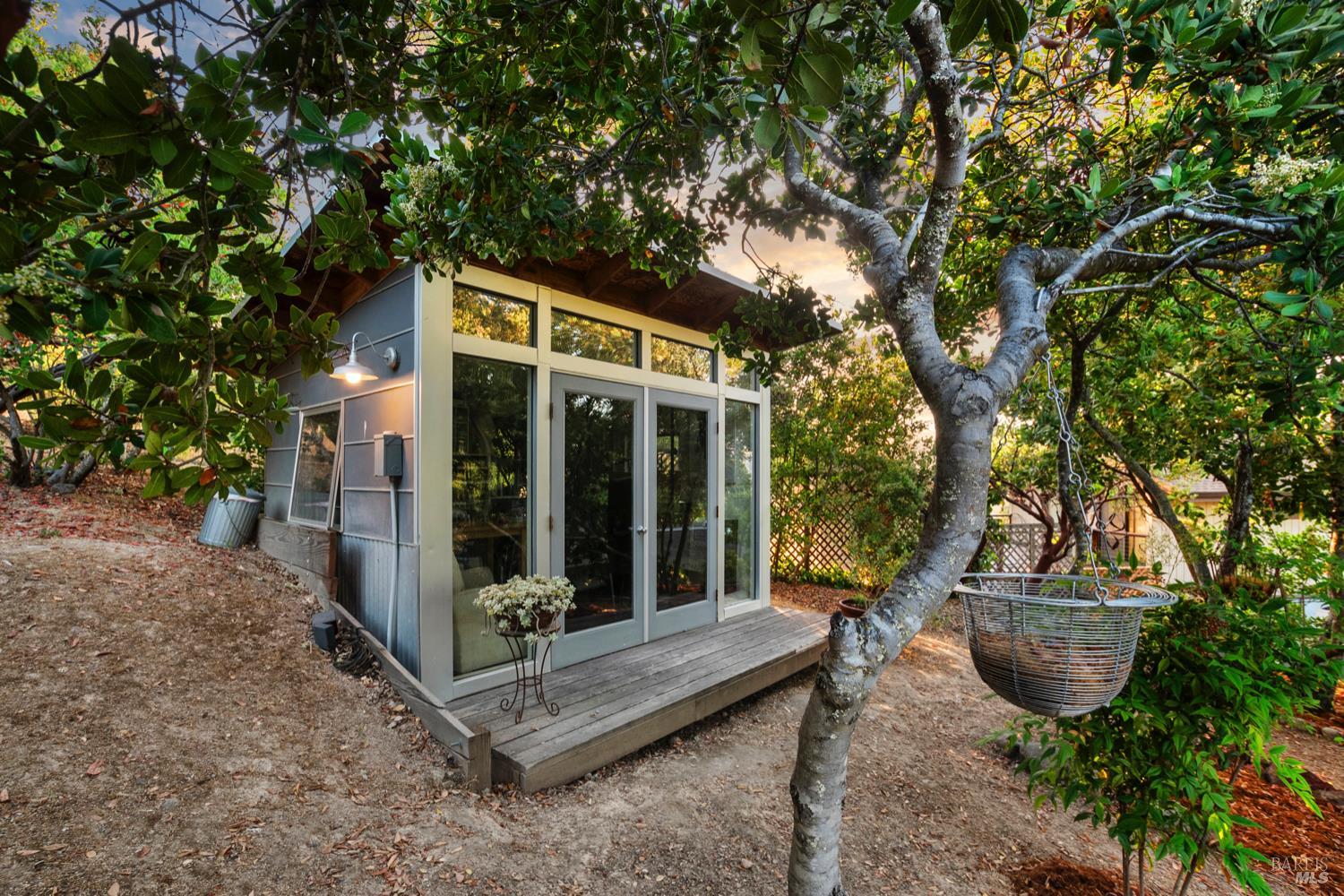 304 High Street Calistoga, CA 94515 - Photo 6 of 53 a view of a patio with table and chairs and floor to ceiling window