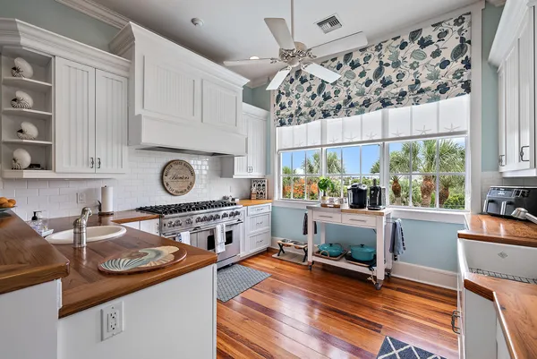 a kitchen with stainless steel appliances granite countertop a stove and a refrigerator