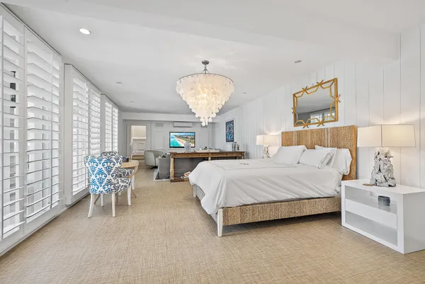 a living room with furniture and a night stand