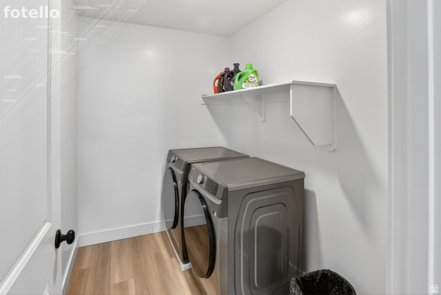 815 West Powderwood Lane Mapleton, UT 84664 - Photo 18 of 39 Laundry room featuring light wood-style flooring and washer and dryer