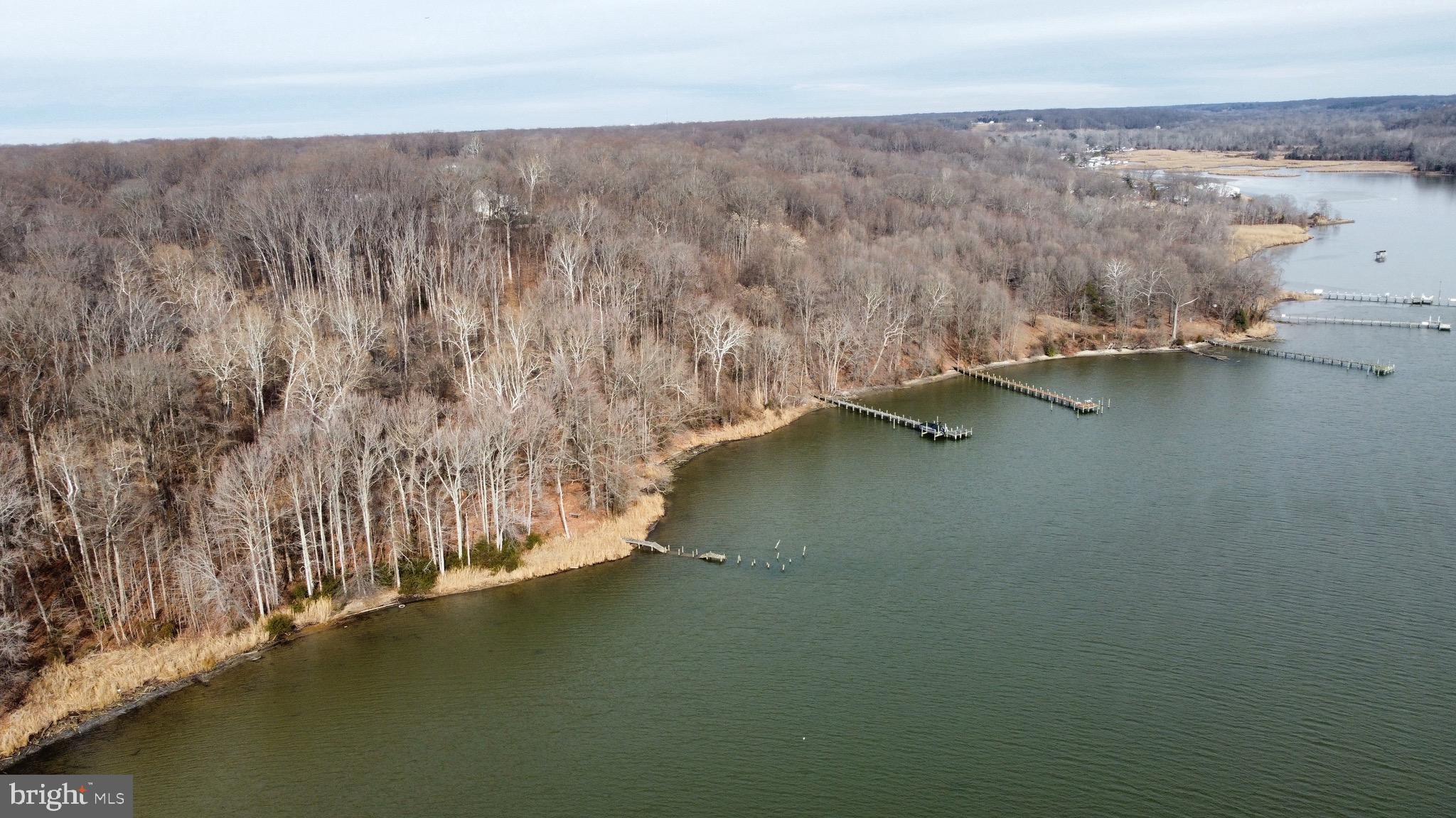 7740 Simms Landing Road Port Tobacco, MD 20677 - Photo 5 of 7 a view of room with lake and mountain view