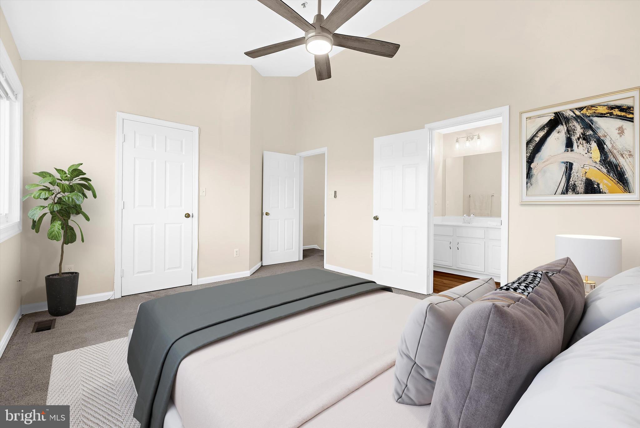 30 Queen Mary Court Chester, MD 21619 - Photo 17 of 60 a bedroom with a bed and a potted plant