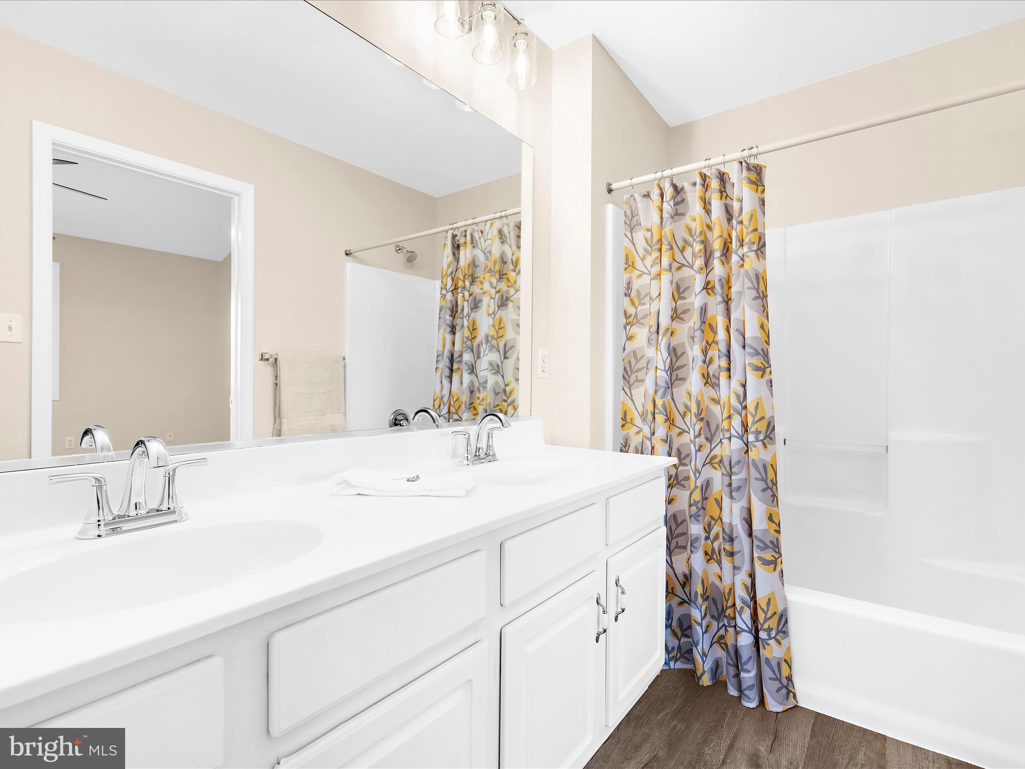 30 Queen Mary Court Chester, MD 21619 - Photo 21 of 60 a bathroom with a sink double vanity and a bathtub