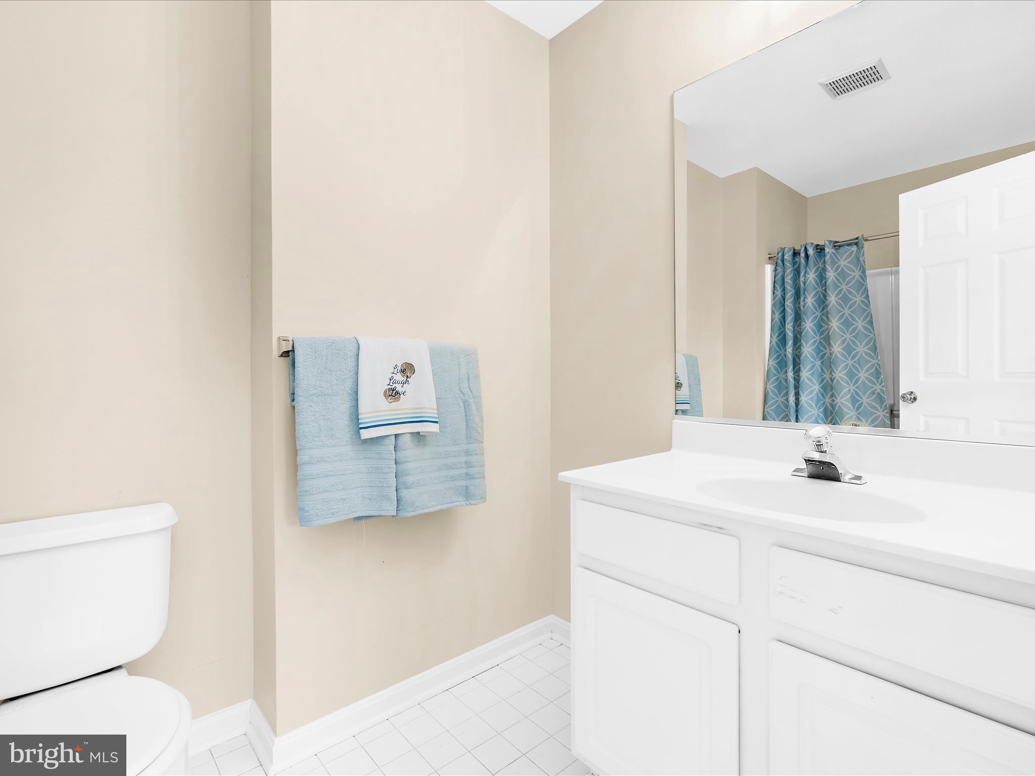 30 Queen Mary Court Chester, MD 21619 - Photo 27 of 60 a bathroom with a sink a toilet and mirror