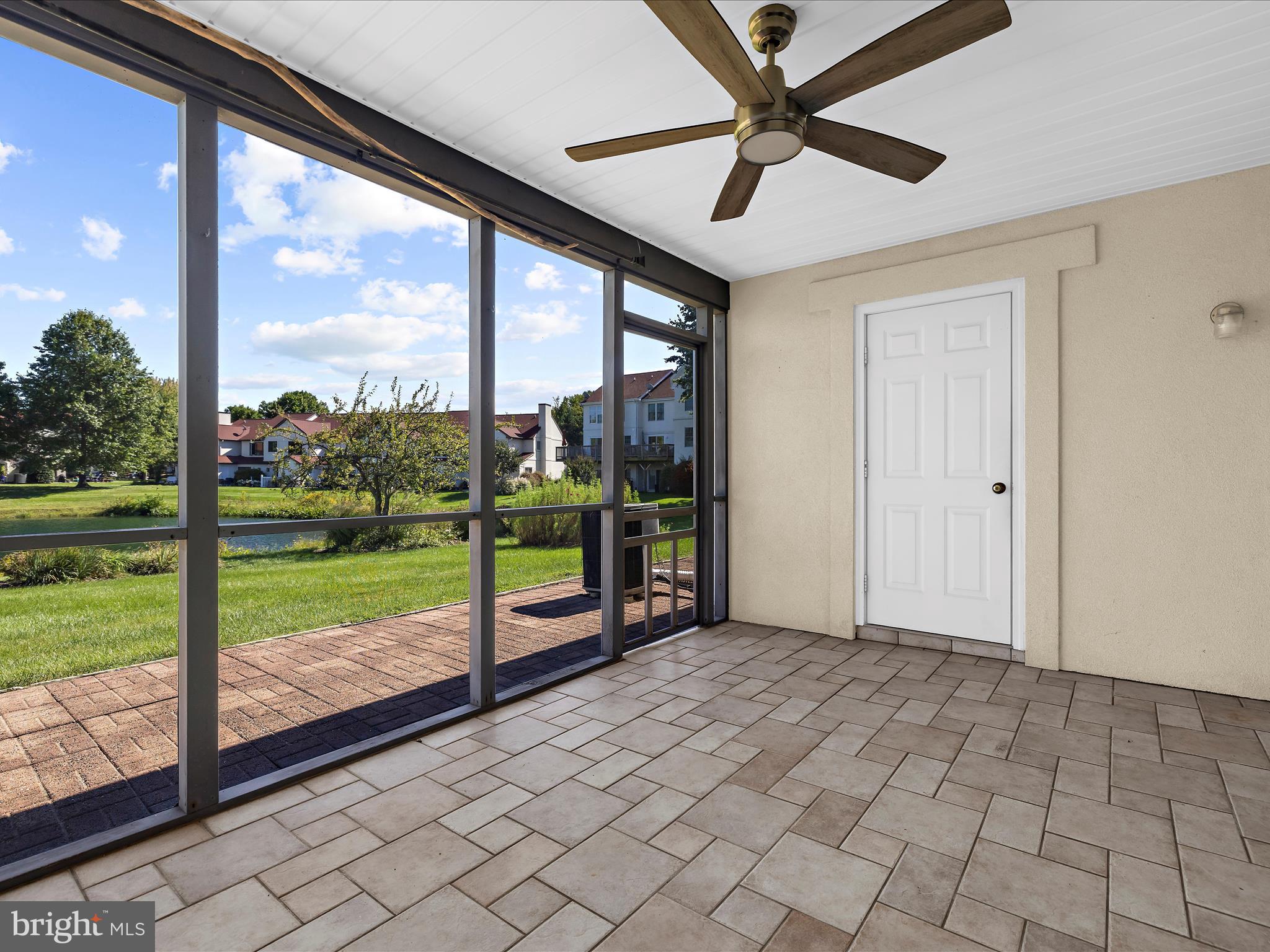 30 Queen Mary Court Chester, MD 21619 - Photo 30 of 60 a view of a porch with a floor to ceiling window and a yard