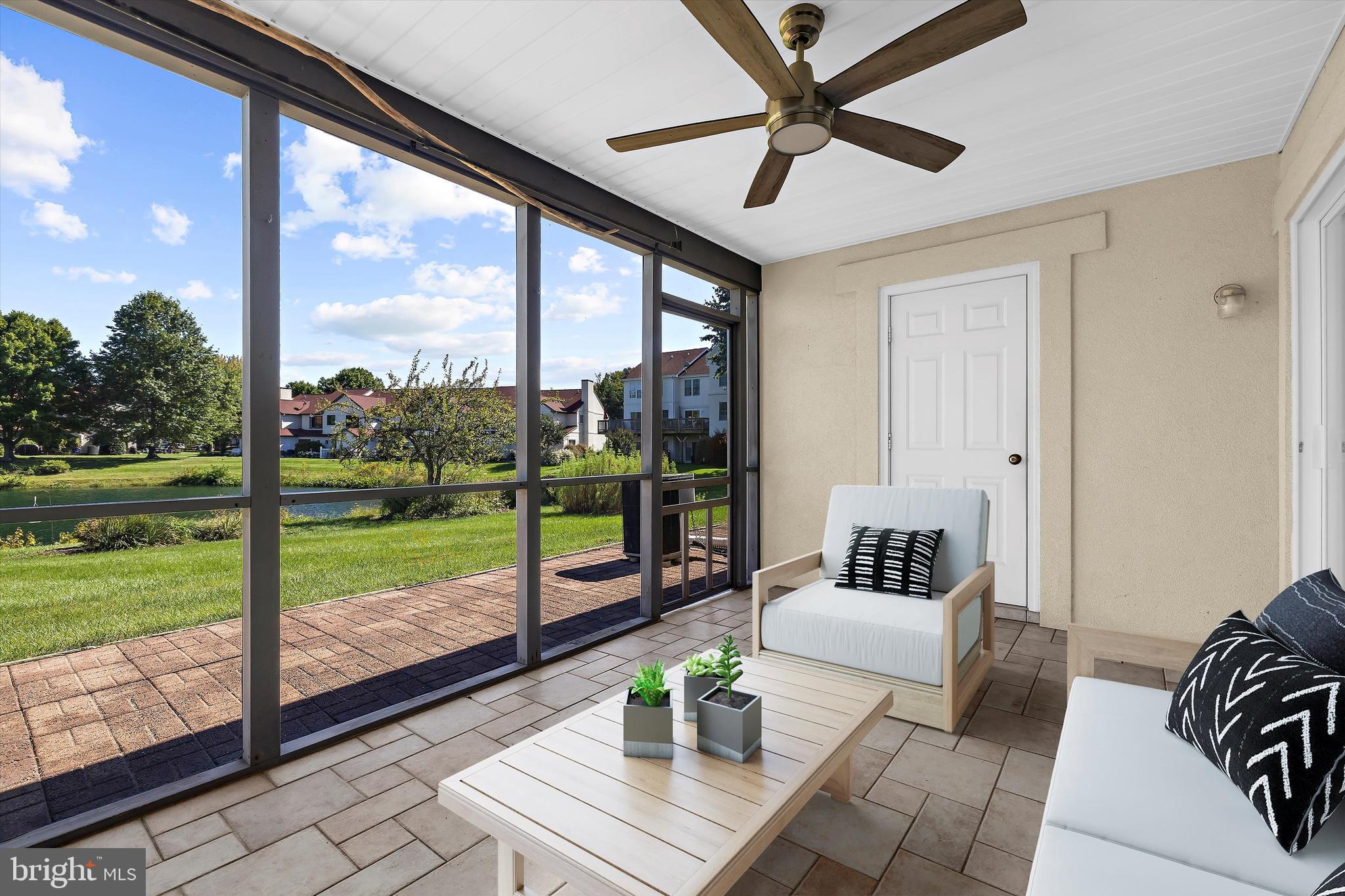 30 Queen Mary Court Chester, MD 21619 - Photo 31 of 60 a living room with garden view and a floor to ceiling window