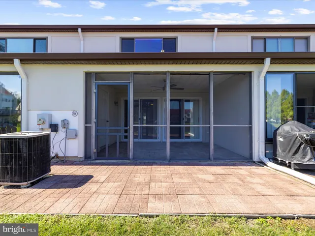 a front view of a building with a garden