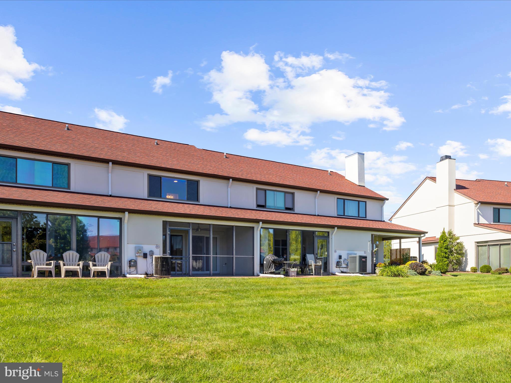 30 Queen Mary Court Chester, MD 21619 - Photo 35 of 60 a front view of a building with a garden