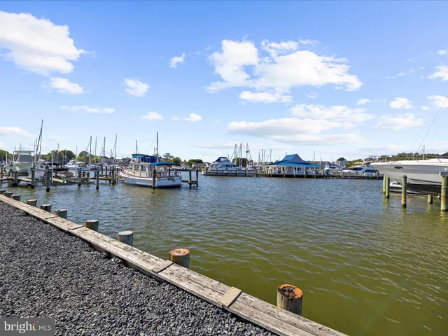 a roof deck with table and chairs