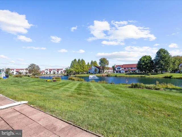 a view of a play house with a big yard