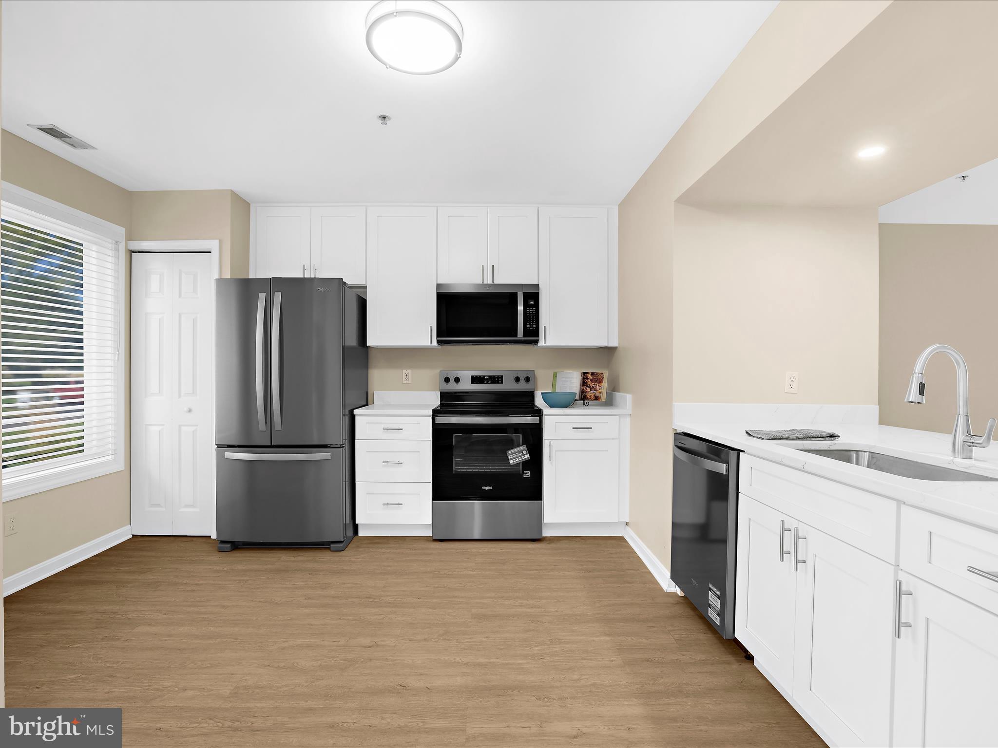 30 Queen Mary Court Chester, MD 21619 - Photo 5 of 60 a kitchen with a refrigerator and a stove top oven
