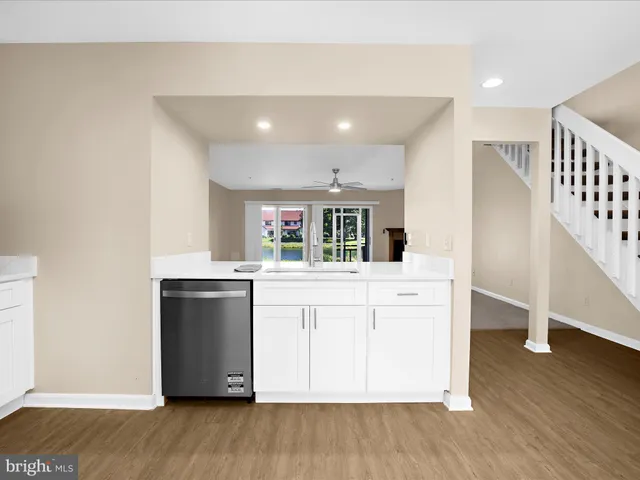 a kitchen with stainless steel appliances a refrigerator stove and microwave