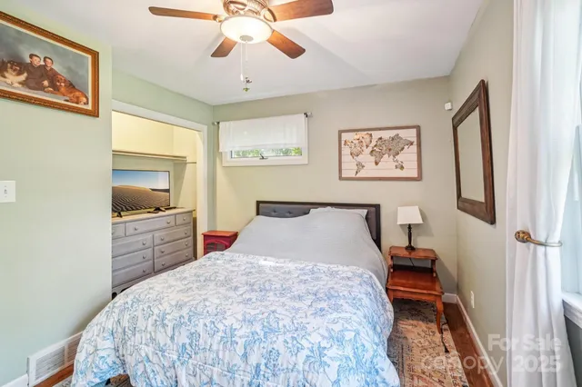 a bedroom with a bed and a table