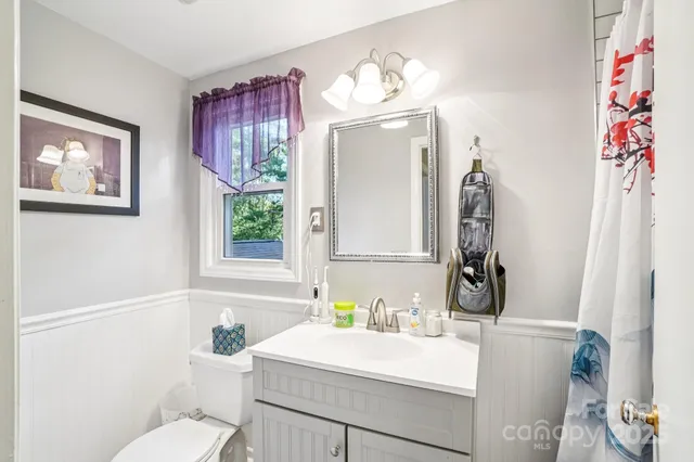 a bed room with a bed furniture and a window