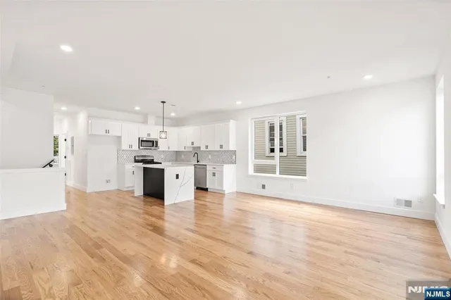 a view of kitchen with wooden floor