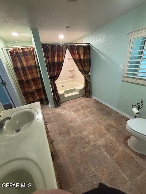 12400 Rojas Drive, Unit 103 El Paso, TX 79928 - Photo 14 of 43 a bathroom with a sink and mirror