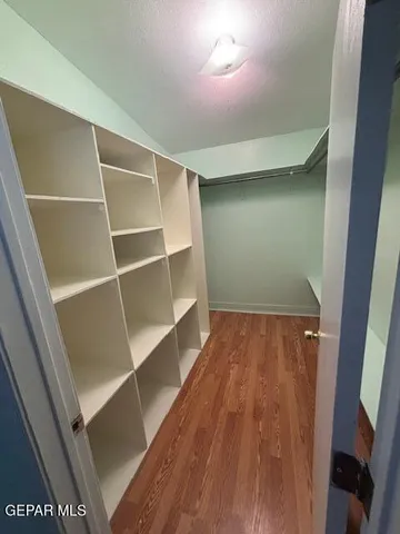 a white toilet sitting next to a bathroom sink and a shower