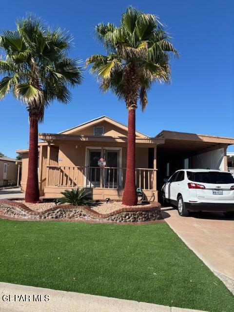 12400 Rojas Drive, Unit 103 El Paso, TX 79928 - Photo 2 of 43 a front view of a house with garden