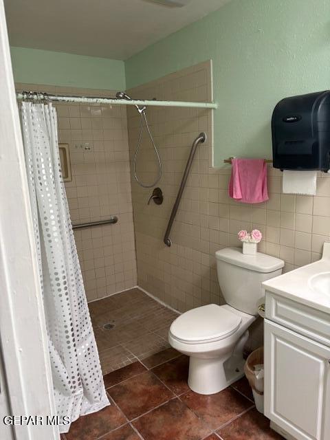 12400 Rojas Drive, Unit 103 El Paso, TX 79928 - Photo 21 of 43 a white toilet sitting next to a bathroom sink and a shower