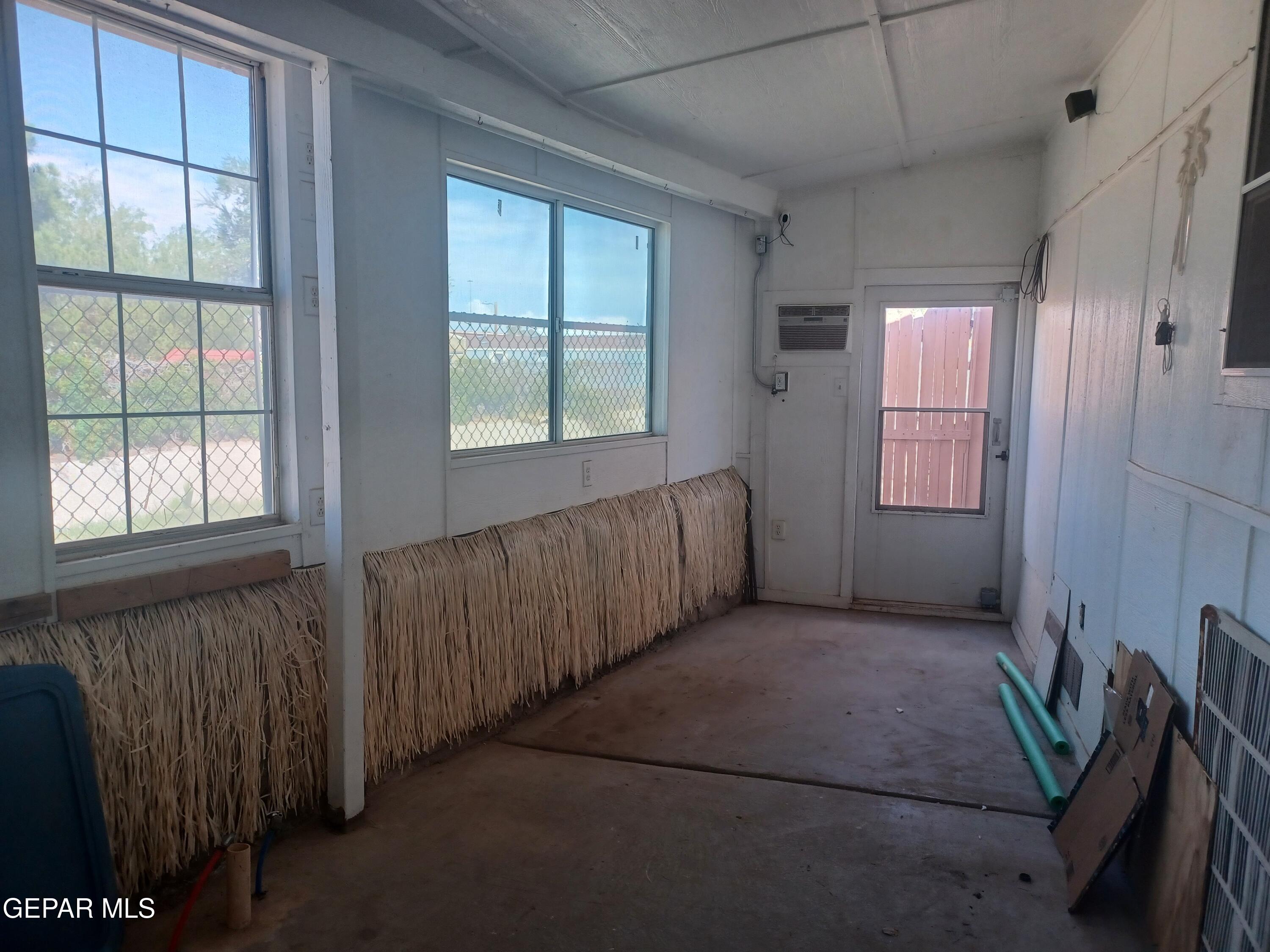 12400 Rojas Drive, Unit 103 El Paso, TX 79928 - Photo 28 of 43 an empty room with windows