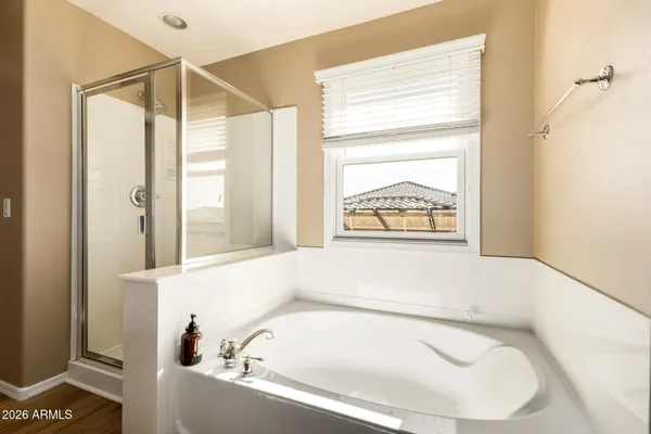 a bathroom with a bathtub and a window