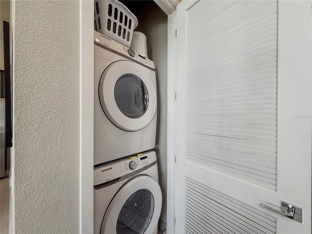 7770 Sandy Ridge Drive, Unit 231 Reunion, FL 34747 - Photo 11 of 25 a utility room with dryer and washer