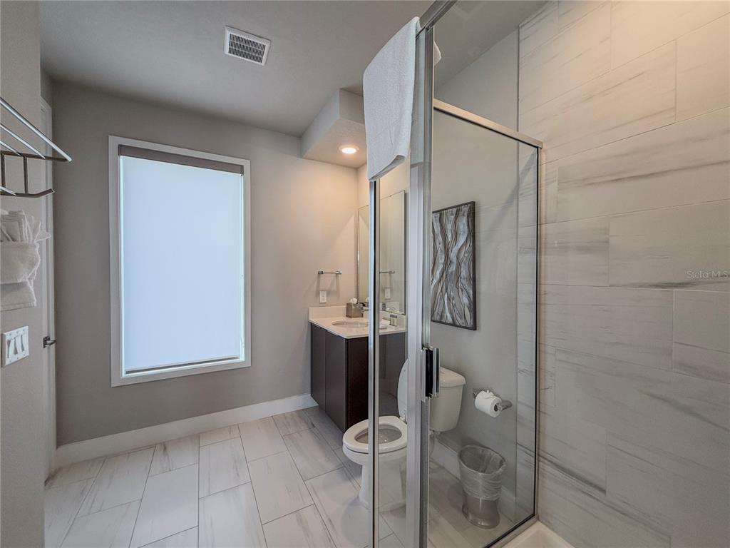 7770 Sandy Ridge Drive, Unit 231 Reunion, FL 34747 - Photo 21 of 25 a bathroom with a shower