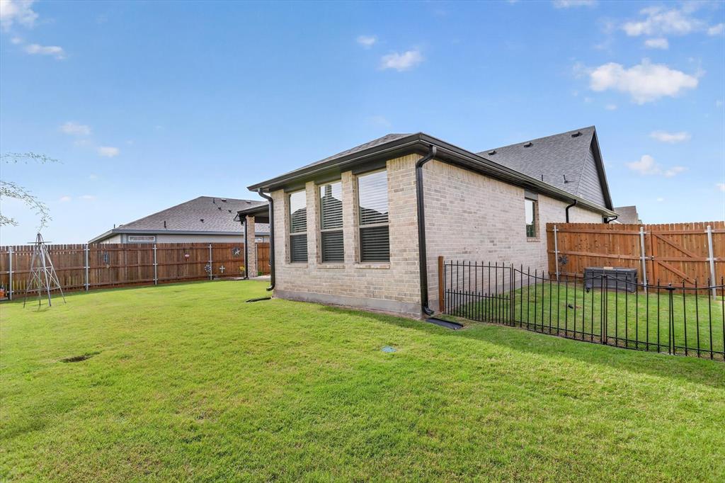 1740 Reverie Road Burleson, TX 76028 - Photo 35 of 37 a front view of a house with a yard