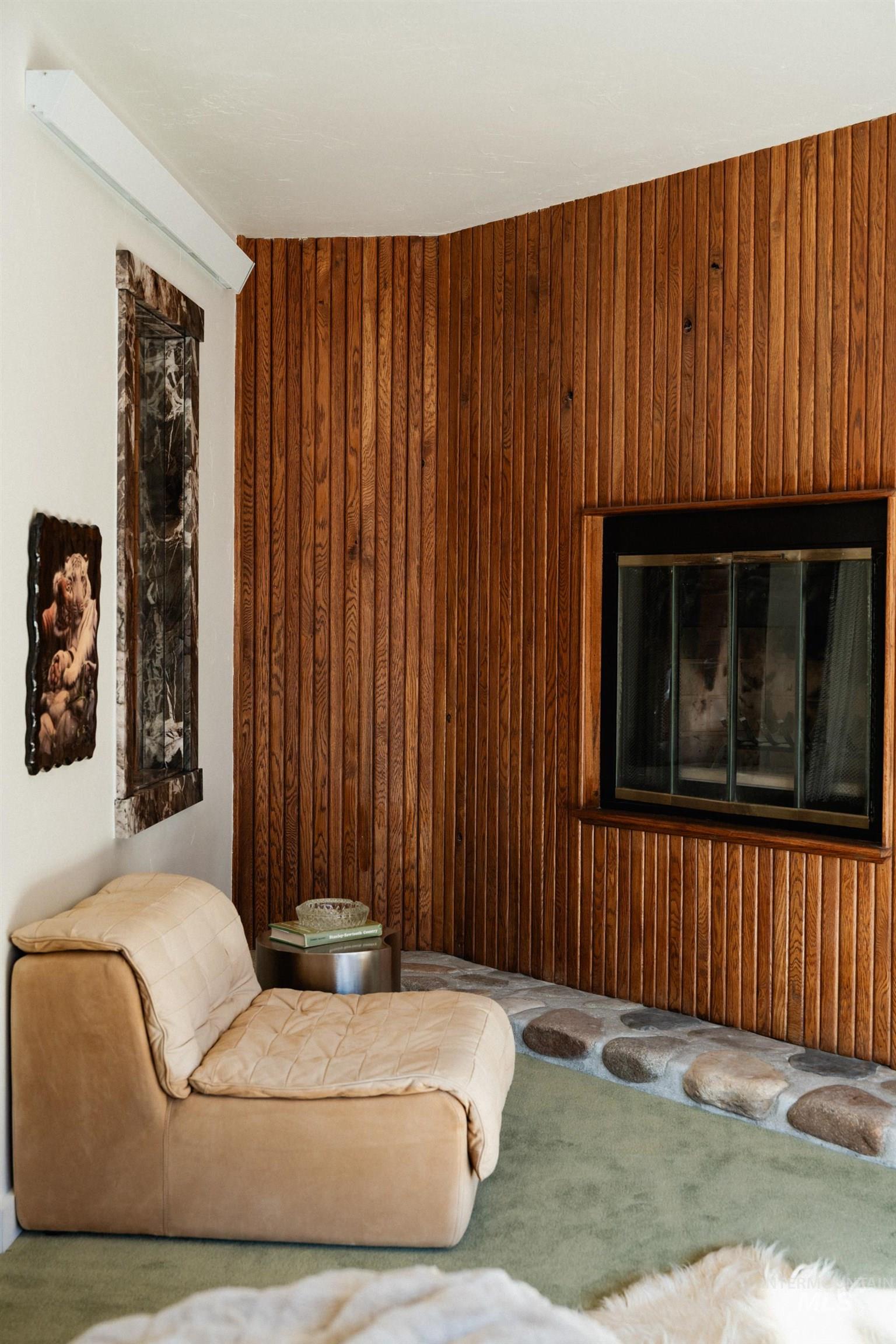 208 Georginia Road, Unit A Ketchum, ID 83340 - Photo 26 of 30 Wood-paneled accent wall with a built-in fireplace